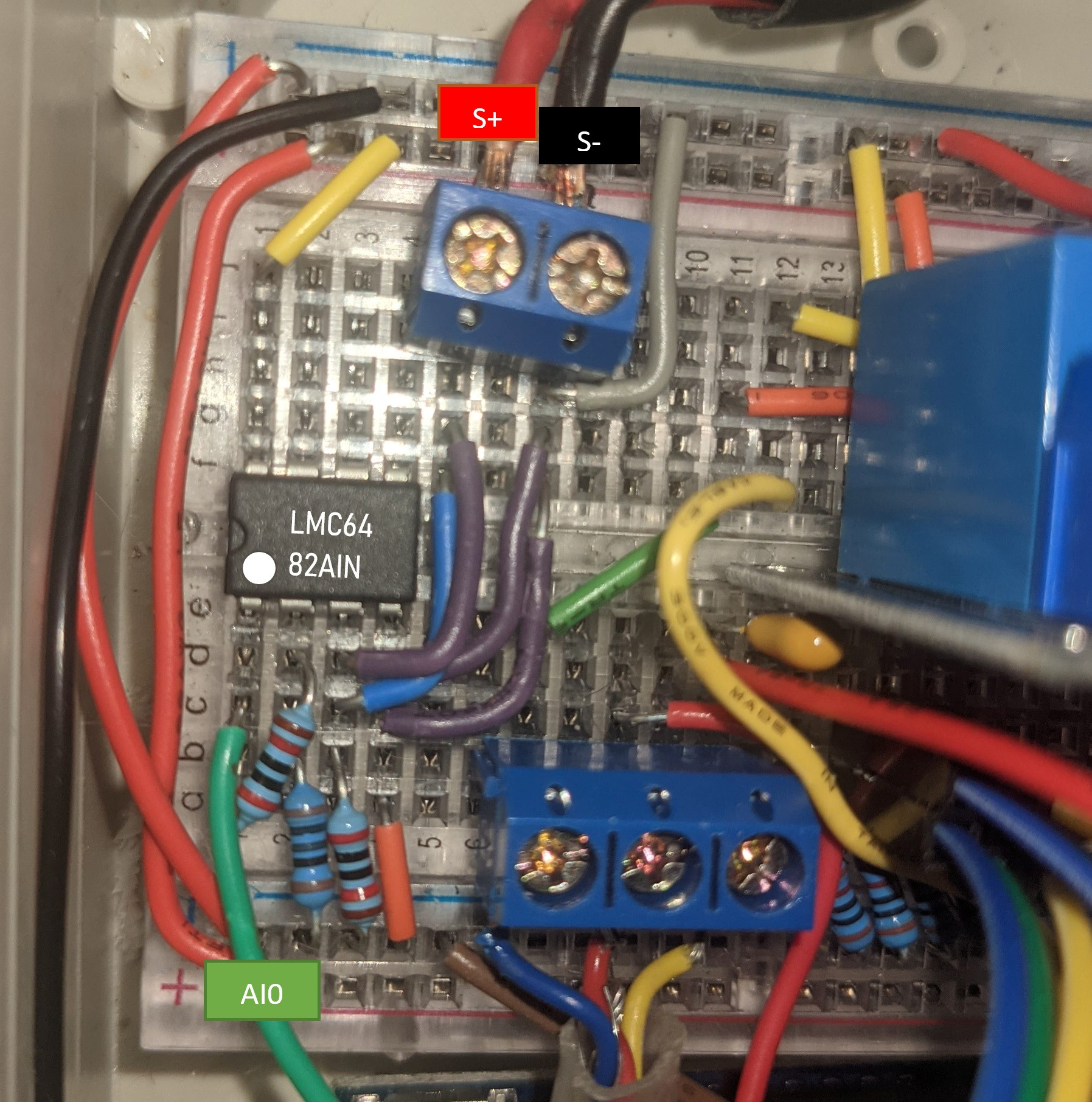 A photograph of the circuit implementation with details highlighted. S+ and S- refer to positive and negative terminals of the oxygen sensor respectively.