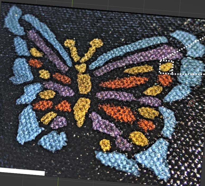 Colorful butterfly painted with structural paint containing tiny aluminum nanoparticles