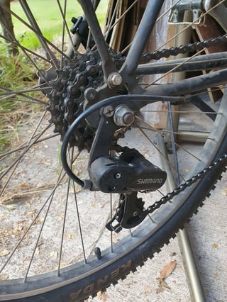 photo of rear mech with chain on fourth cog