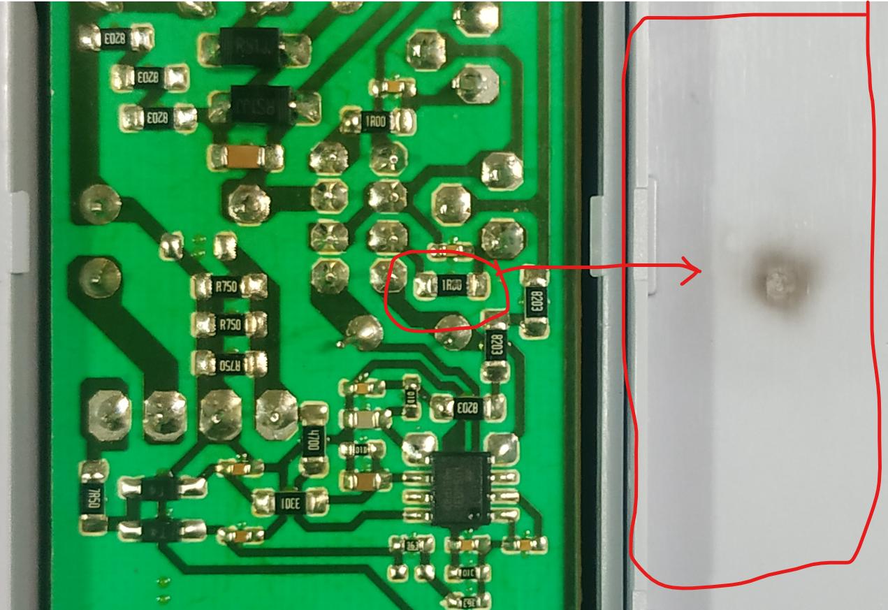 image of a PCB with a burnt out component marked