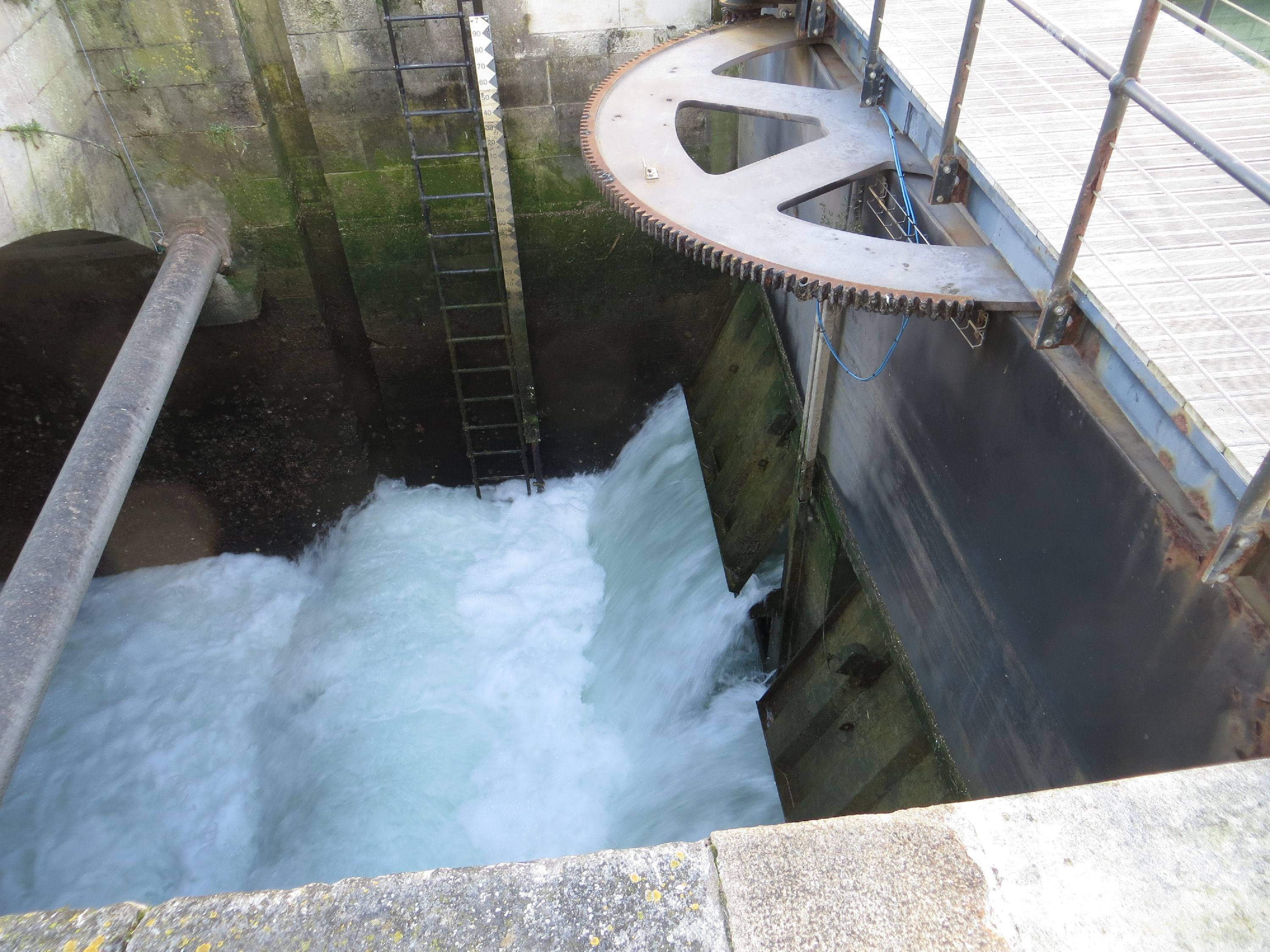 water streaming out of a sluice