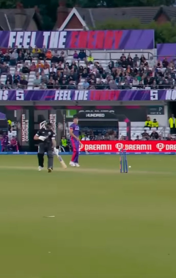 long view of batter showing wickets lit and not touching the ground