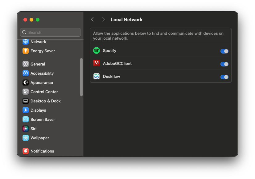 Screenshot of a window showing the Local Network settings. The only applications shown are Spotify, AdobeGCClient, and Deskflow; all are enabled.