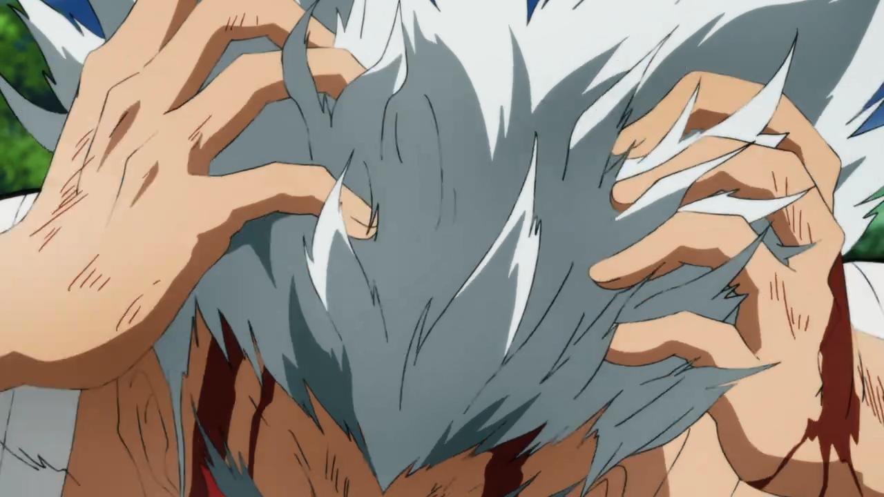 Garou wipes his bloody hands through his hair