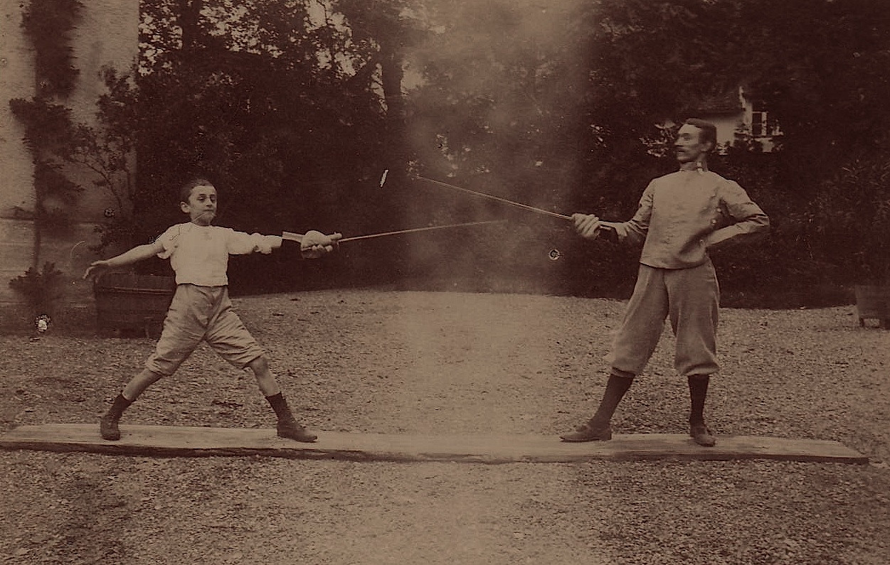 Fencing instructor and young student on an early planche