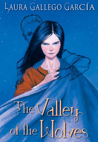 Cover of "The Valley of the Wolves". The cover has a blue background with stars. There is a dark-haired, pale-skinned girl with blue eyes looking straight ahead; there is the ghostly silhouette of a boy behind her, reaching a hand around her shoulder to hold hands with the girl.