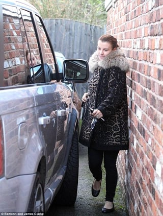 Car door close to brick wall