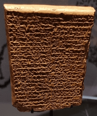 picture of mostly intact clay tablet with cuneiform writing