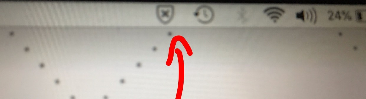 picture of macOS menu bar with a shield like icon and x inside