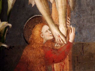 Mary Magdalene kissing the feet of the crucified Jesus