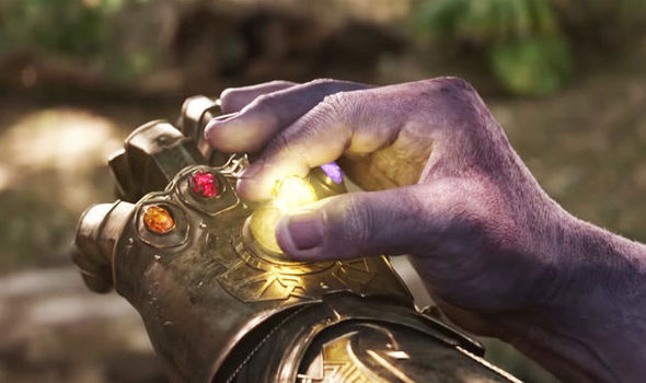 Thanos putting mind stone into Infinity Gauntlet