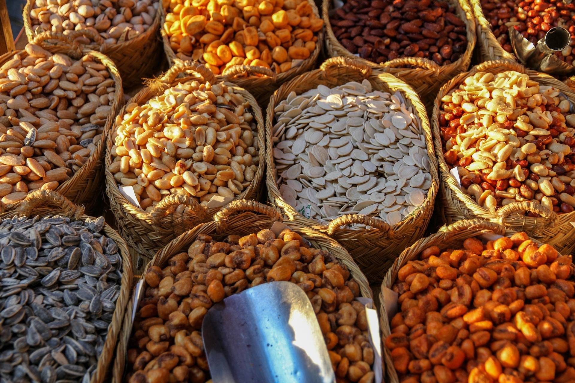 image of various squash seeds at a market, including pumpkin seeds