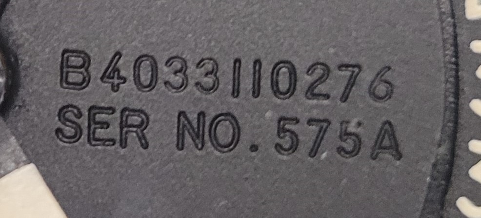 close-up of model and serial number on faceplate