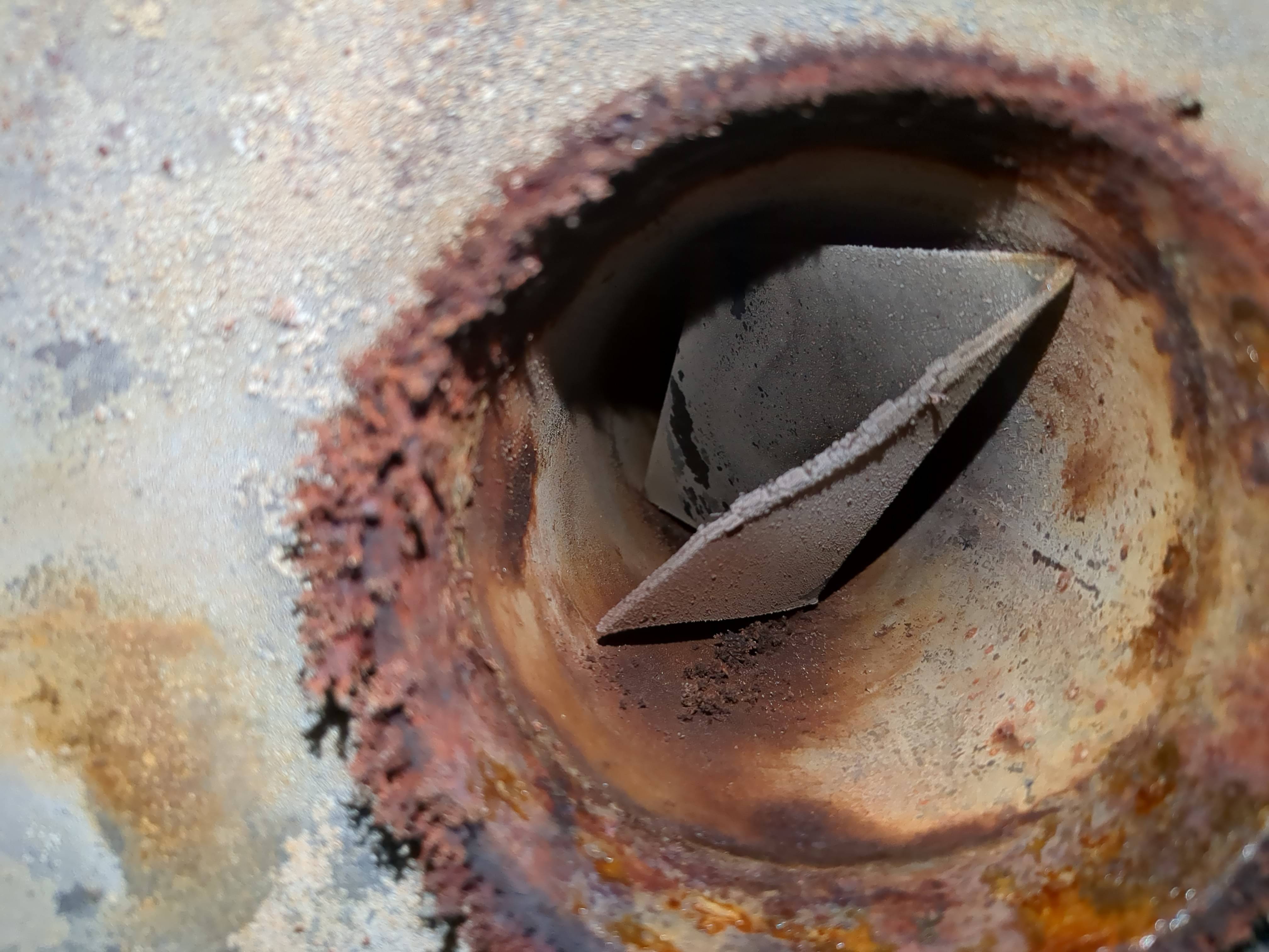 Photo inside hot water tank pointing upwards