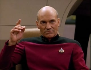 Picard making a "Engage" hand sign