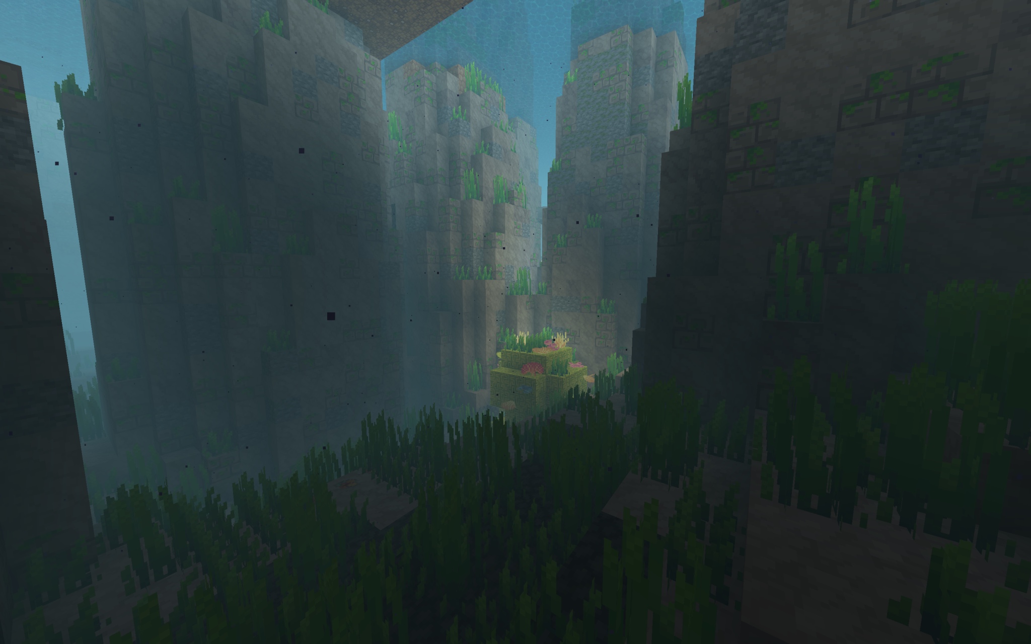 Modded Minecraft 1.19.2 screenshot of a lone underwater coral surrounded by BYG Lush Stacks stone pillars