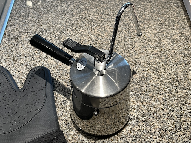 A stovetop coffee maker with the valve in the closed position