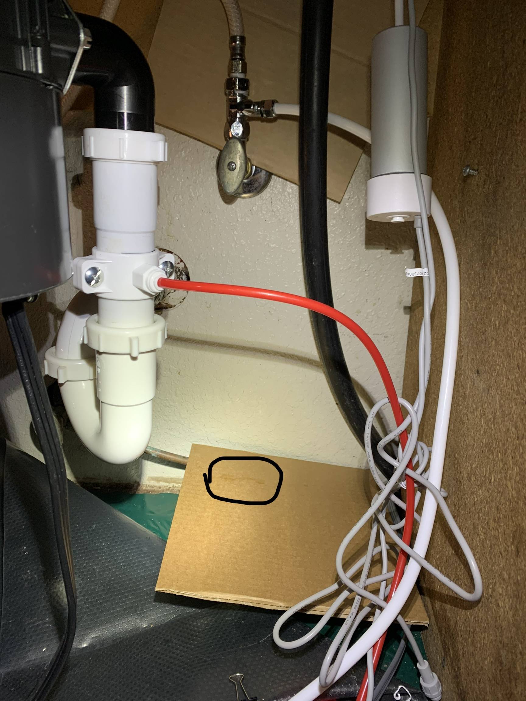 my install with leak on cardboard circled