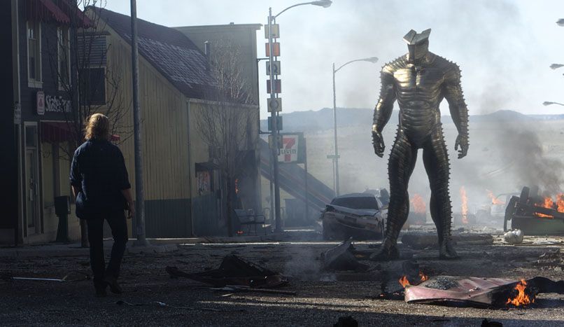 Thor and the Destroyer face off amid wreckage of a town