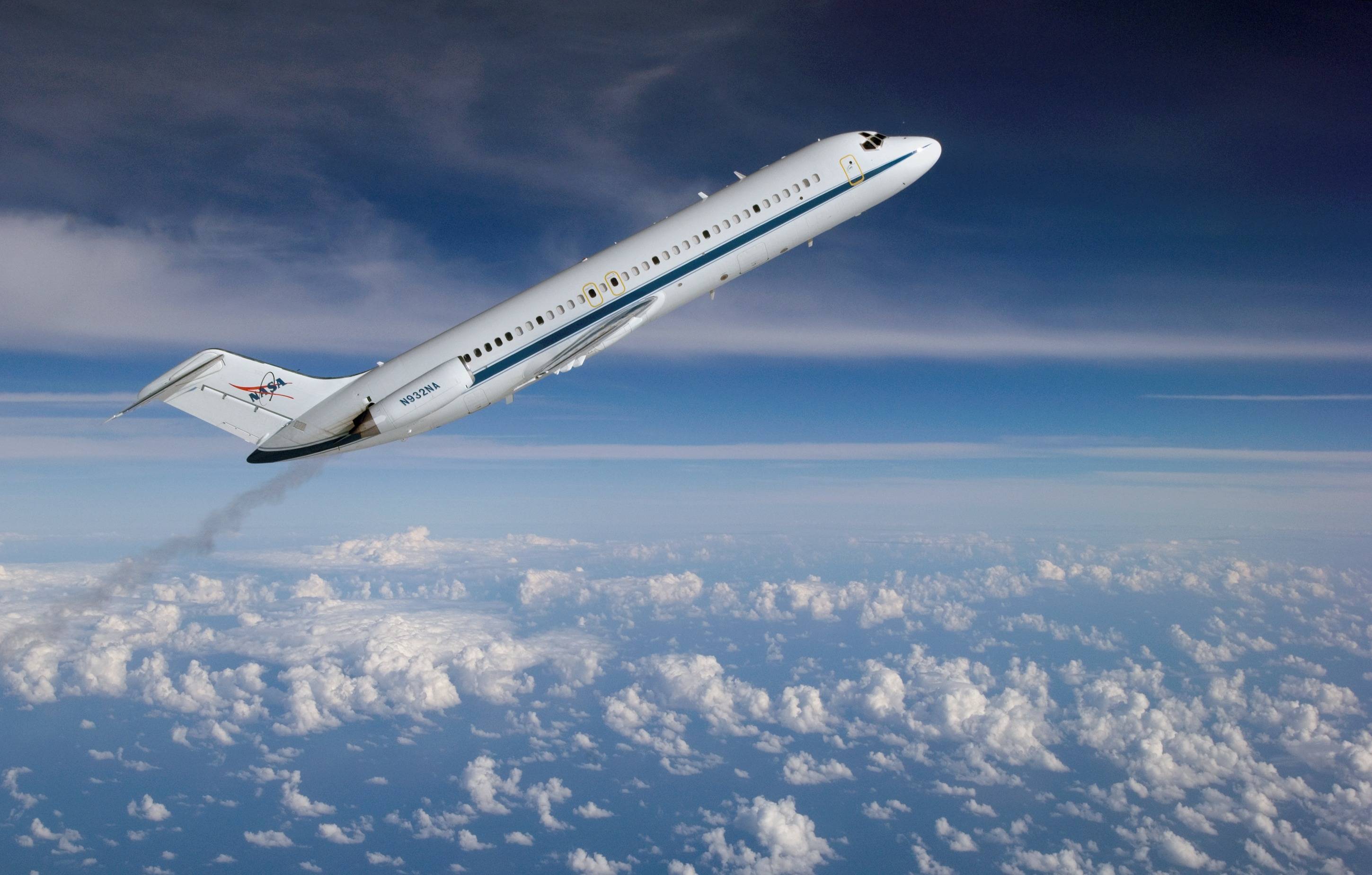 large NASA jet flying at 35-40 degrees above horizon