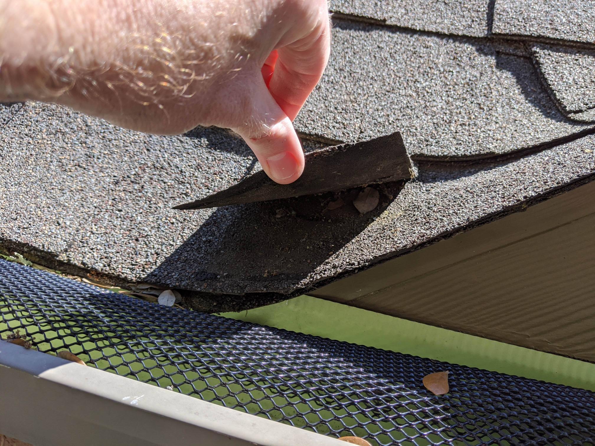 Lifting up a top-layer flap on an architectural shingle