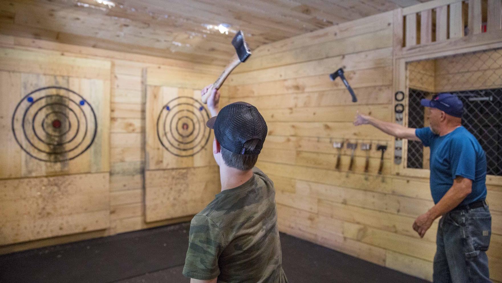 Two bros throwing axes