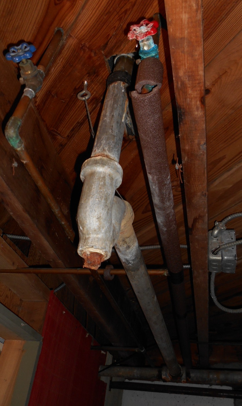 view of drain under bathtub