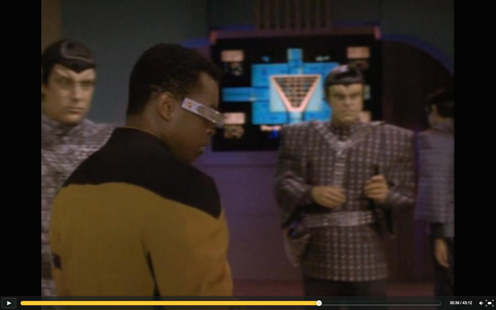 After commercial, they return from singularity and La Forge approaches console, just before he notices the alien