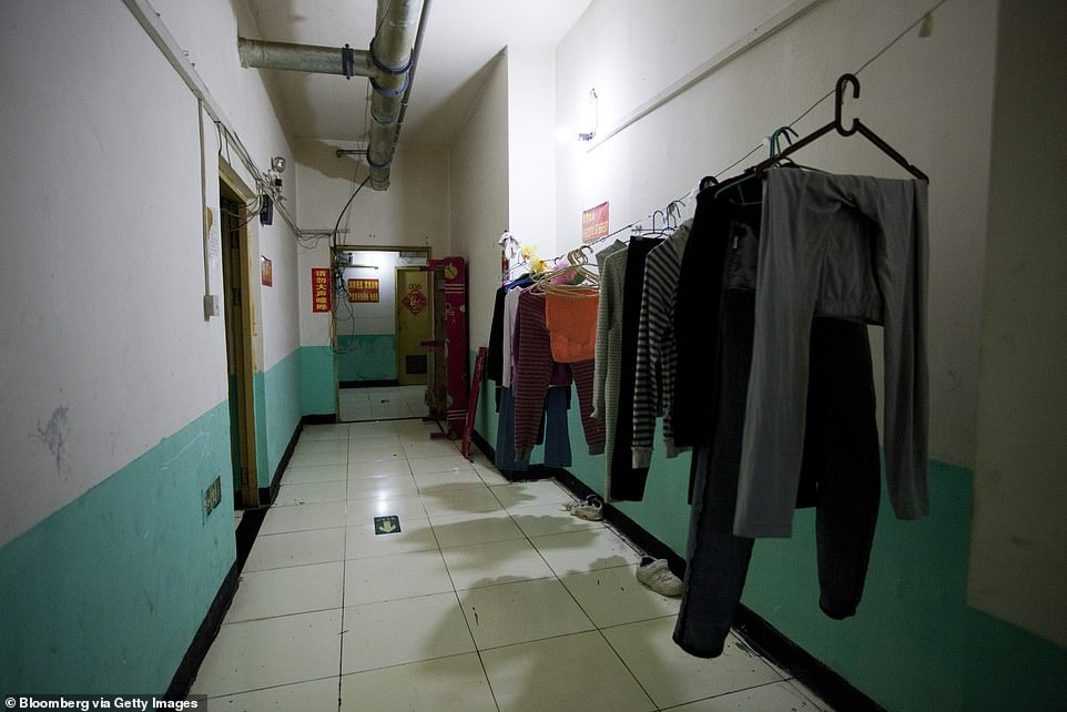 A hallway with clothes hanging to dry