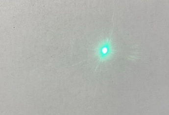 Laser spot on light coloured surface