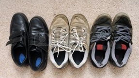 Three pairs of shoes on the carpet