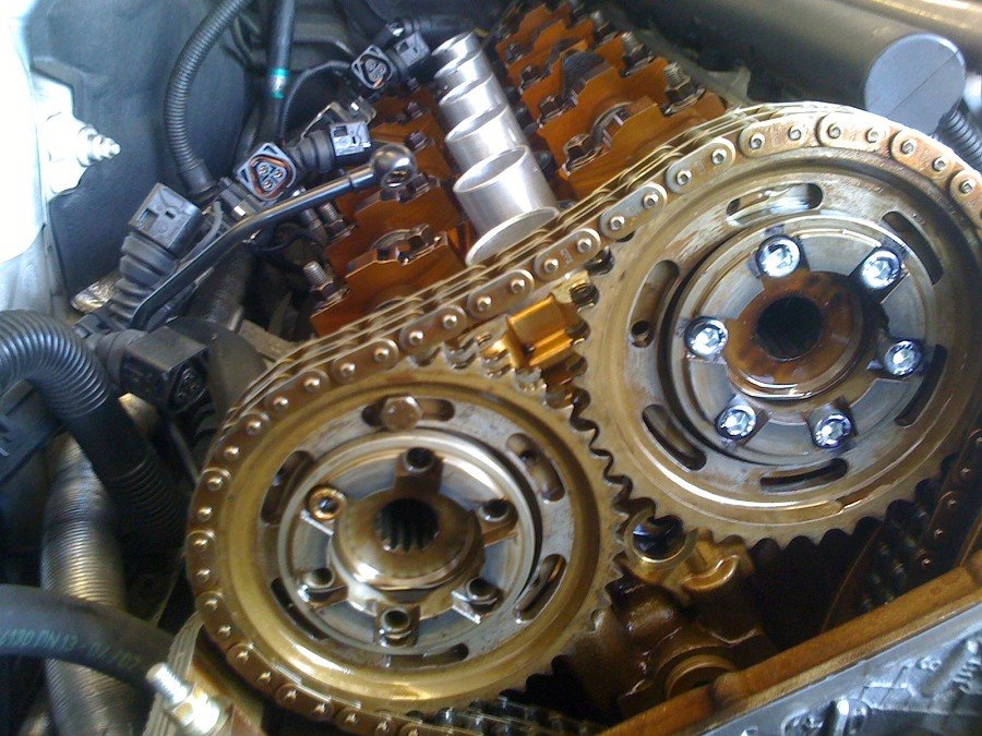 picture of engine with valve cover removed, cam gears exposed and meshed to each other with timing chain installed