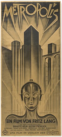 Famous monochromatic movie poster of mechanical woman with a city backdrop.