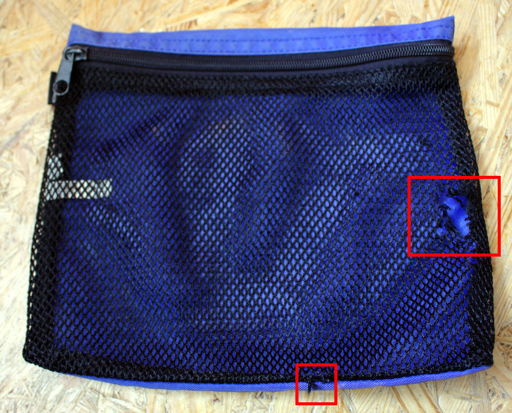 Synthetic pouch with tears in mesh highlighted