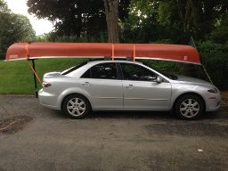 Putting a canoe on a roof rack sale