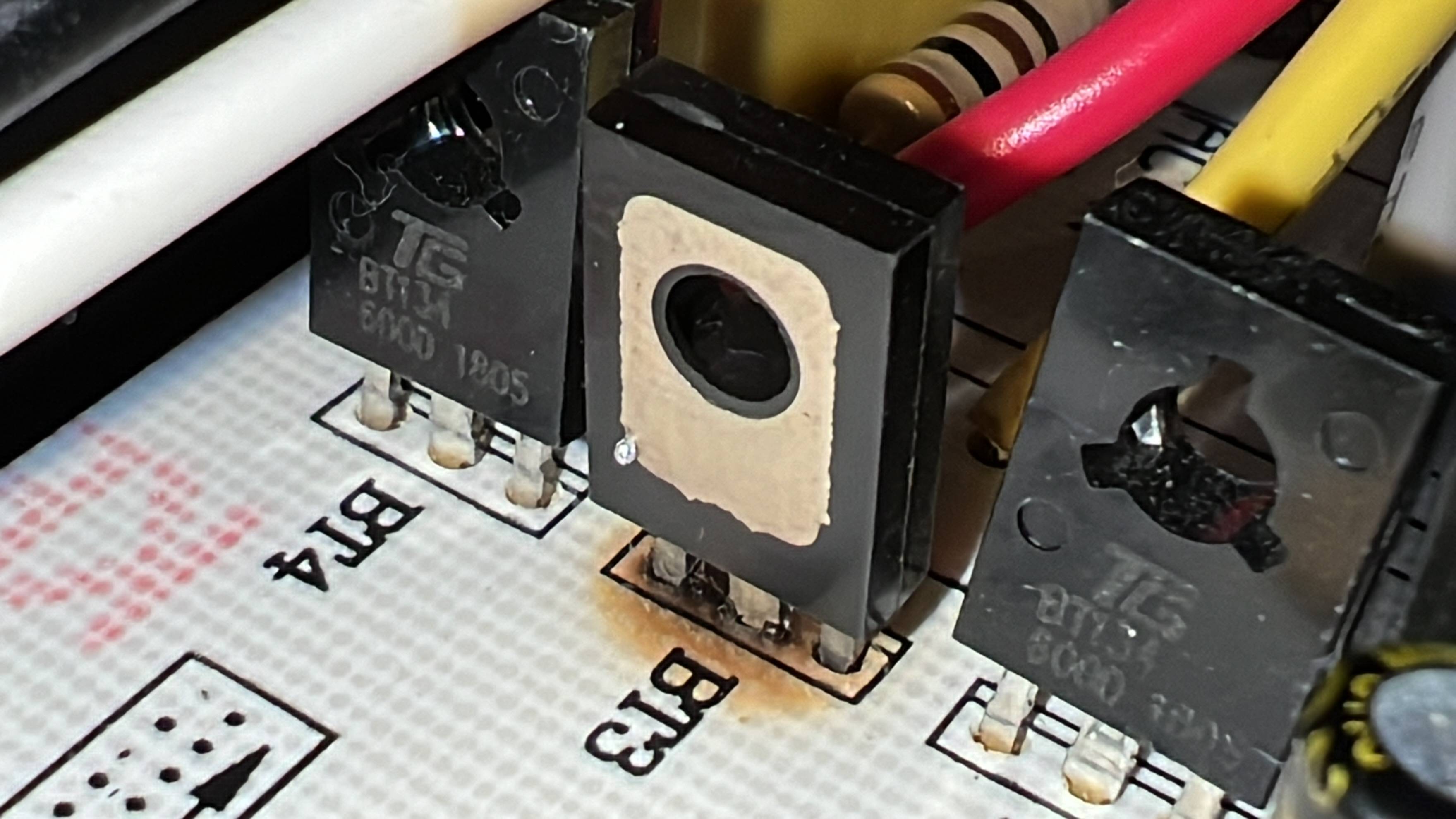 closeup of the 3rd triac soldered with face opposing the other three