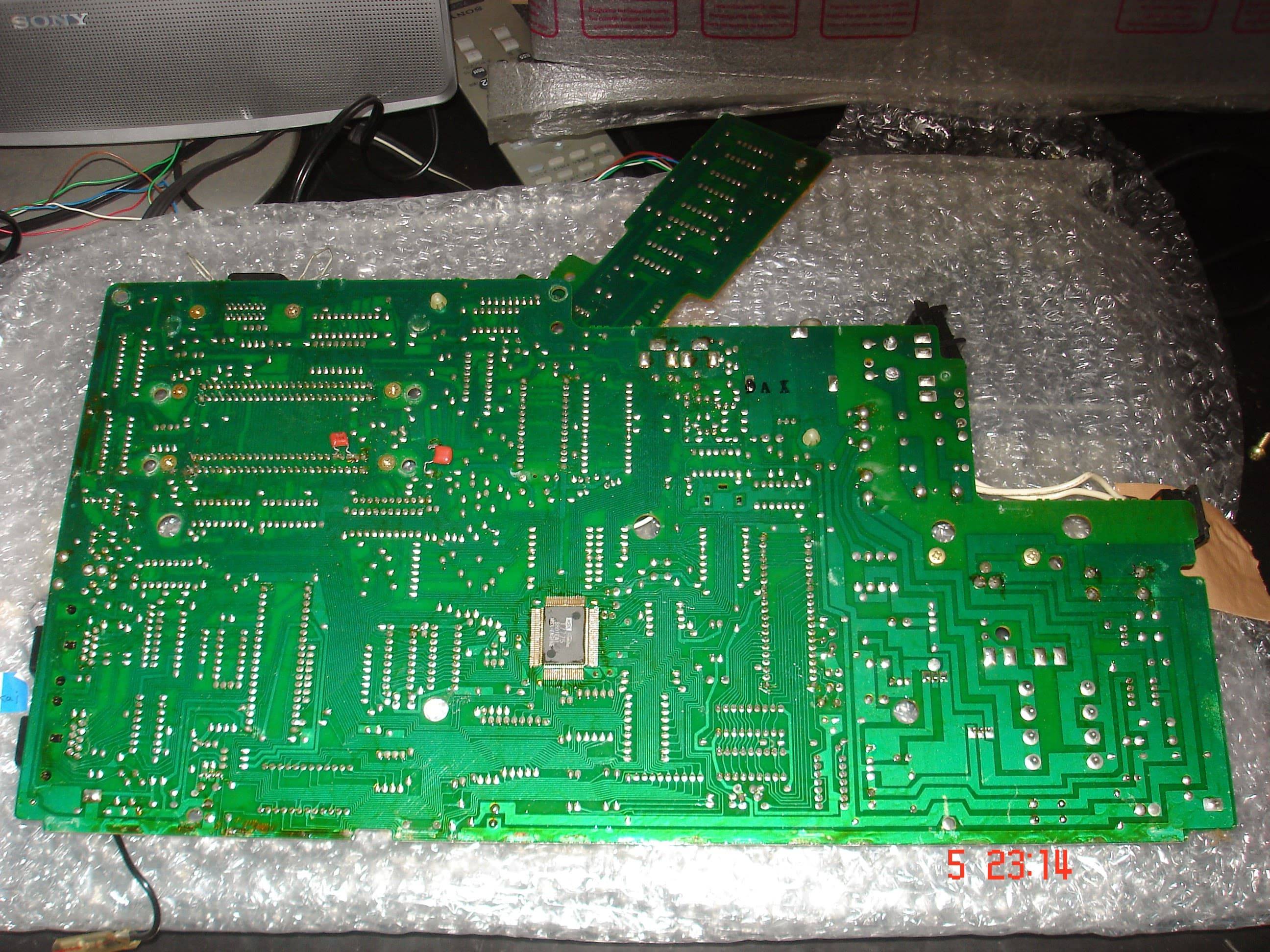 Solder side of Sanyo MPC-1 showing a SMD chip on the center of the board