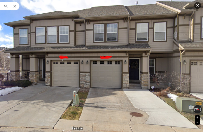 Townhouses with two neighboring concrete driveways