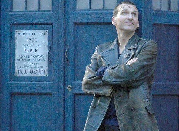 The 9th Doctor in front of the Tardis