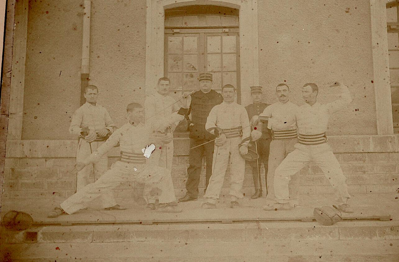 1896 photograph of fencers on a planche made of joined boards