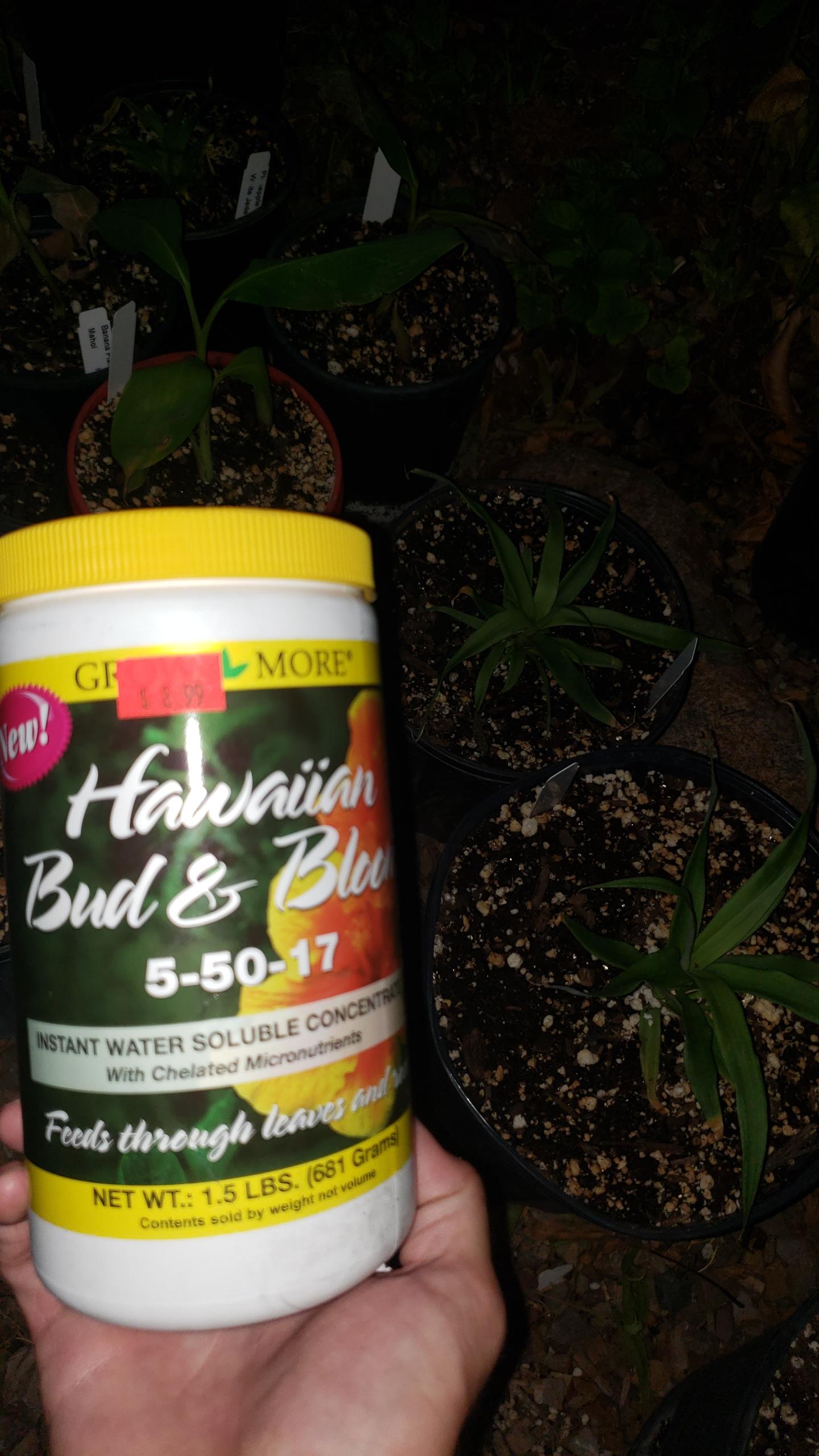 N-P-K 5-50-17 the middle number helps flowering and root growth..this stuff can kill a plant by burning, so use at half strength and twice as often when hot outside