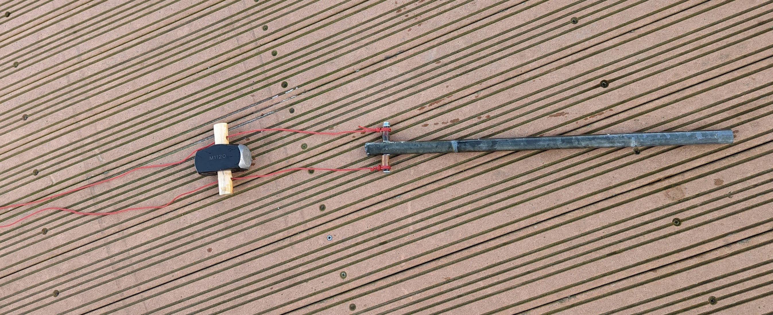 Drop weight guided by strings drop on a metal pole