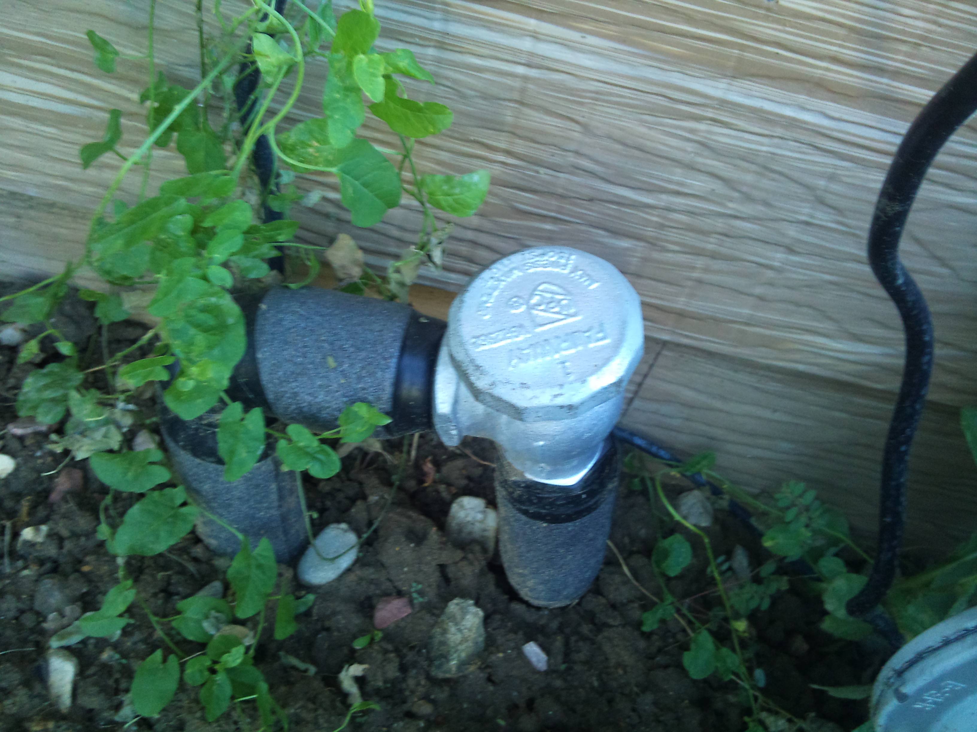 Photo of sprinkler system pipe and cap