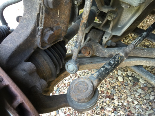 front drivers side steering and suspension showing sway bar linkage detached