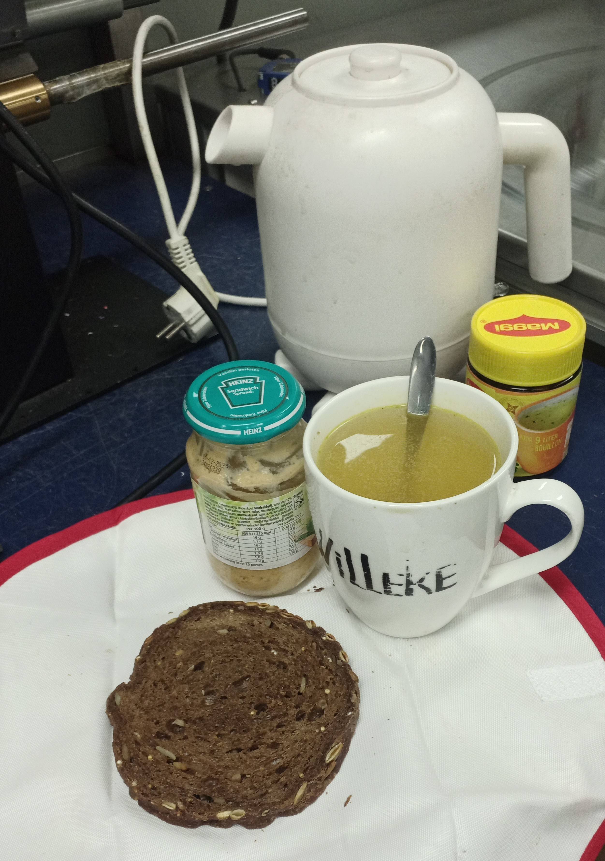 slice of bread, cup of drink and some jars