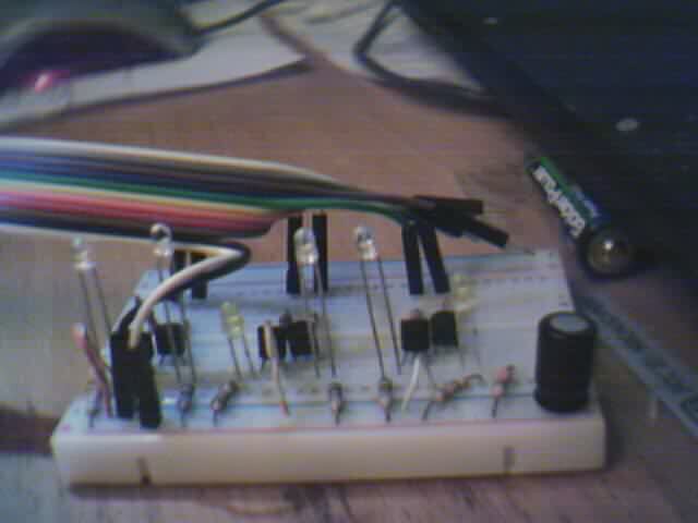 A small breadboard fitted with various small passive and discrete TO92 packaged transistors