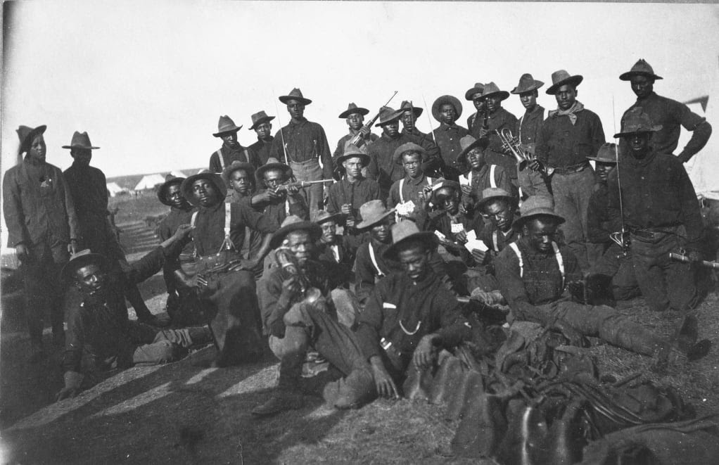 Buffalo Soldiers black and white photo standing on a hill