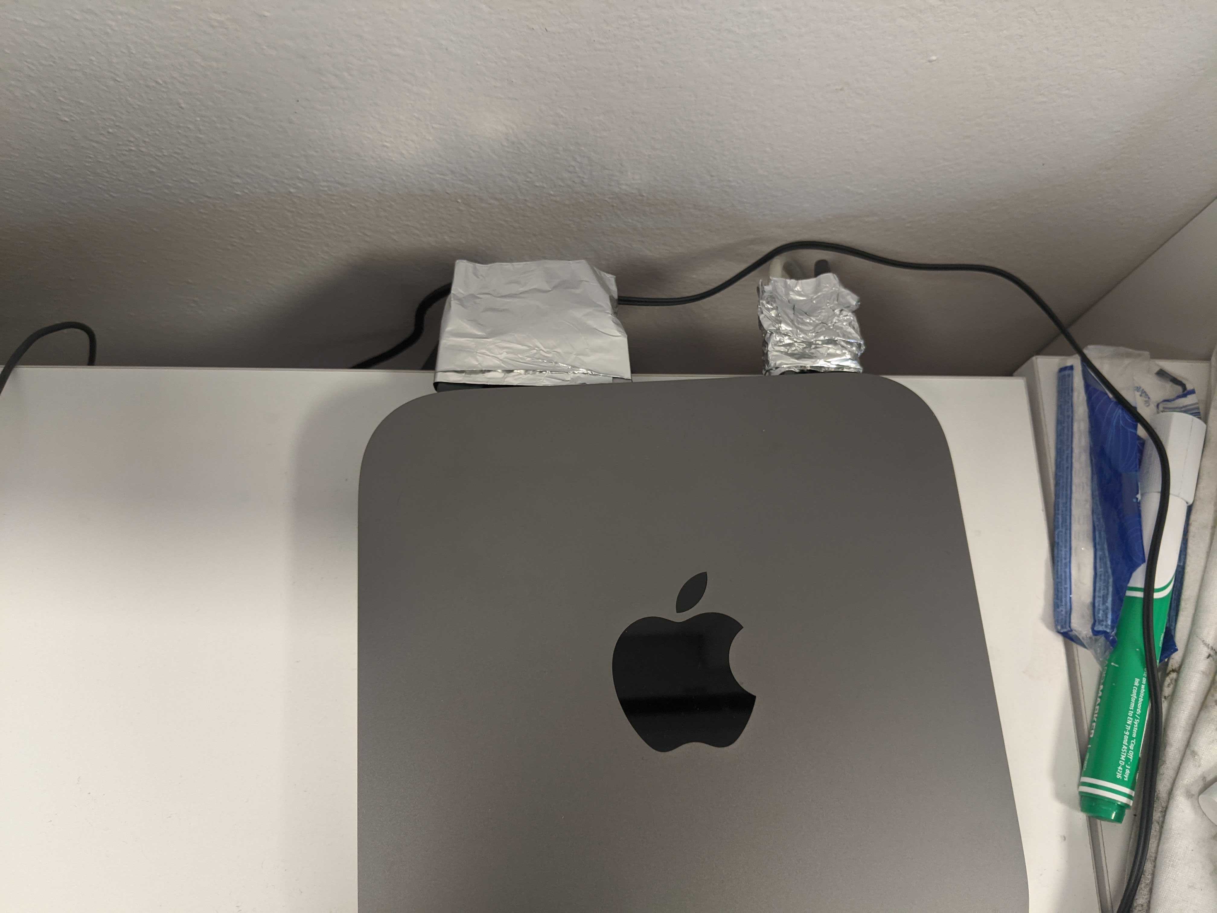 cables connected to Mac Mini wrapped with aluminum foil on the connectors