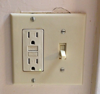 Switchplate with broken drywall on top