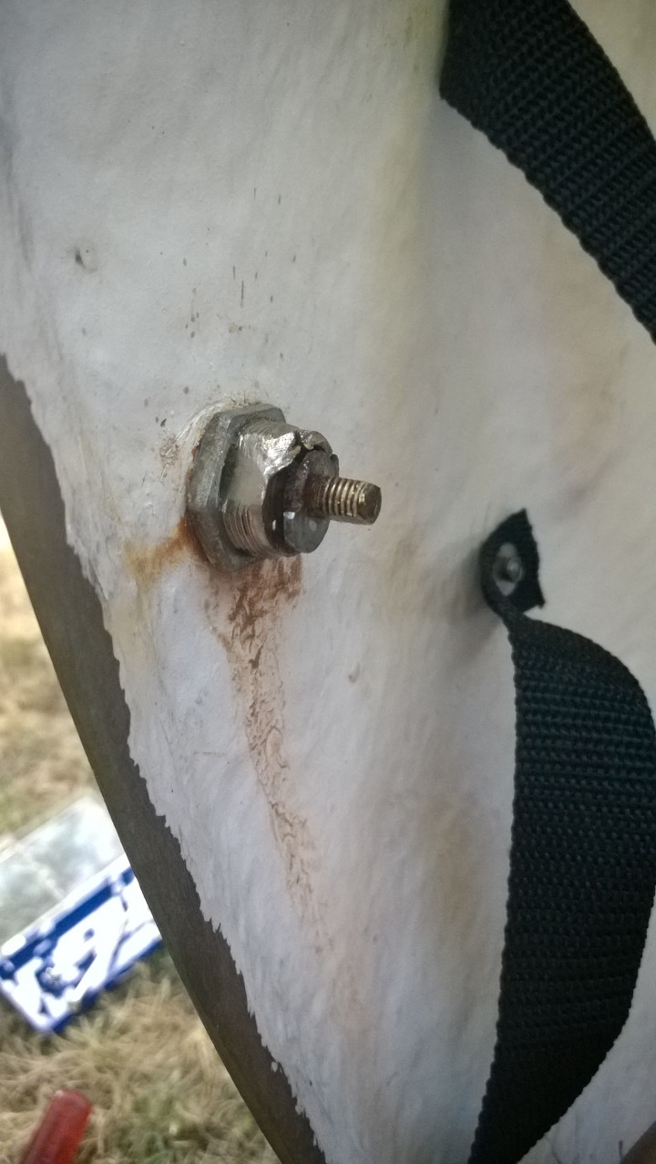 Packasport Car Top Carrier with rusted lock - note locking nut is the large one right next to the white fiberglass surface